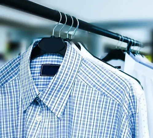 Dress shirts hanging neatly after laundering